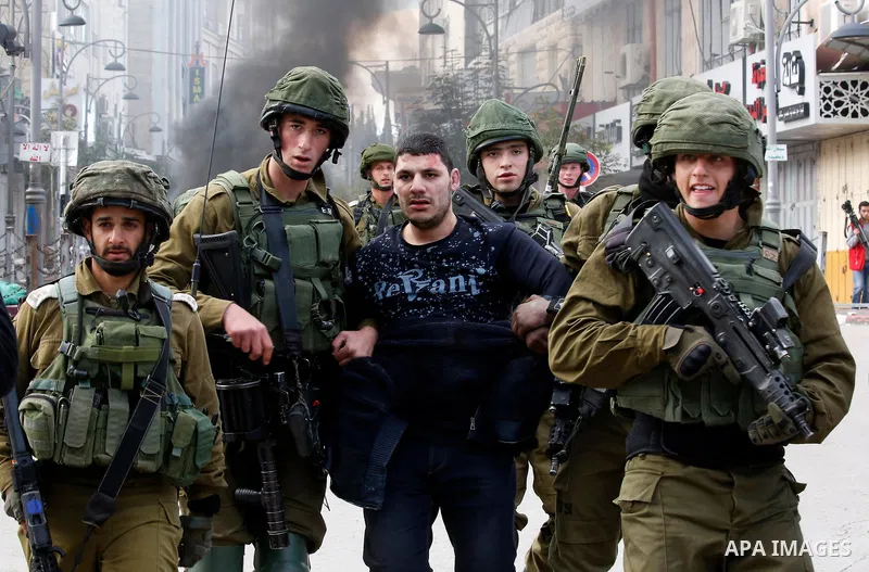 Israeli forces detain a Palestinian protester during clashes that followed protests against a decision by US President Donald Trump to recognise Jerusalem as the capital of Israel, in Hebron in the Israeli-occupied West...