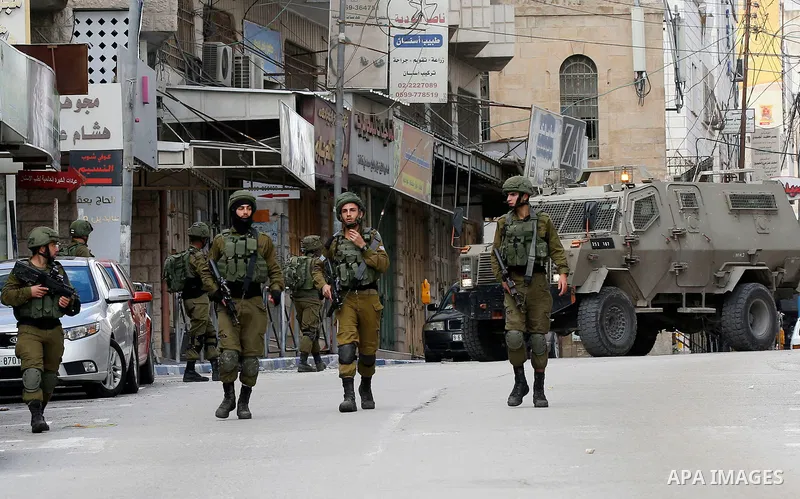 Israeli border policemen take position during clashes that followed protests against a decision by US President Donald Trump to recognise Jerusalem as the capital of Israel, in the West Bank city of hebron on December 7,...