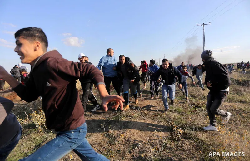 Palestinian protesters clash with Israeli forces on December 8, 2017 near the border fence with Israel, east of Gaza City. Palestinians clashed with Israeli security forces after calls for a "day of rage" as US President...