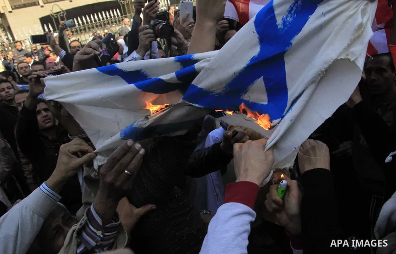 Egyptian Protestors shout slogans during a demonstration against US President Donald Trump's decision to recognize Jerusalem as the capital of Israel at al-Azhar mosque in Cairo on December 8, 2017. Tens of thousands of...