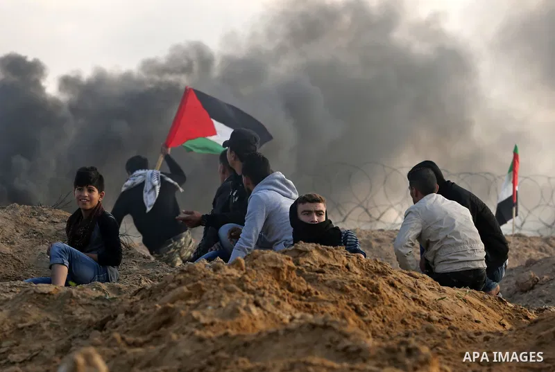 Palestinian protesters clash with Israeli forces at the Bureij refugee camp, in central Gaza on December 8, 2017. Palestinians clashed with Israeli security forces after calls for a "day of rage" as US President Donald T...