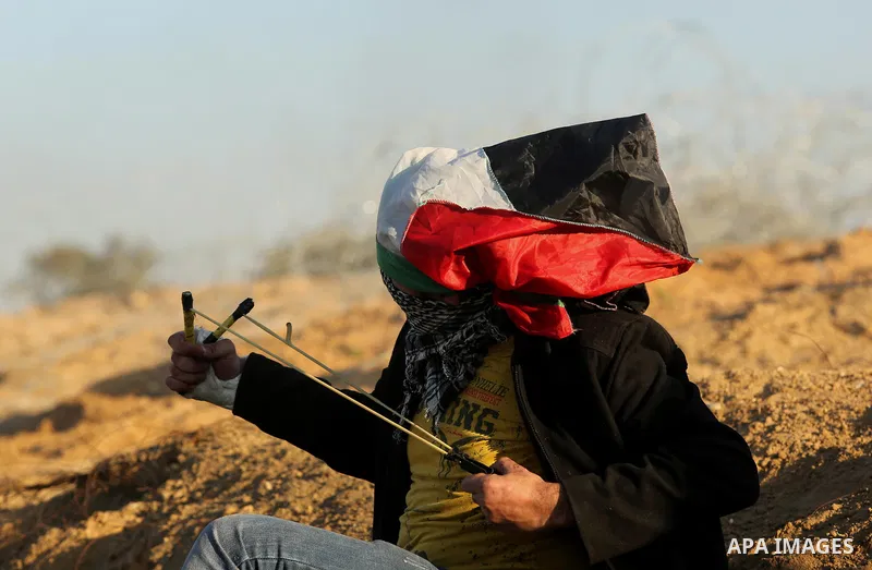 Palestinian protesters clash with Israeli forces at the Bureij refugee camp, in central Gaza on December 8, 2017. Palestinians clashed with Israeli security forces after calls for a "day of rage" as US President Donald T...