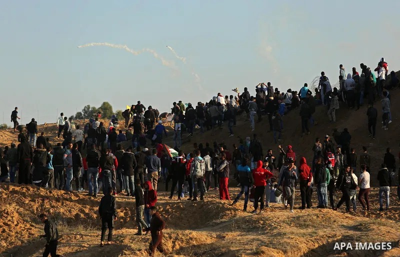 Palestinian protesters clash with Israeli forces at the Bureij refugee camp, in central Gaza on December 8, 2017. Palestinians clashed with Israeli security forces after calls for a "day of rage" as US President Donald T...