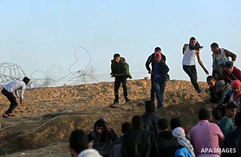 Palestinian protesters clash with Israeli forces at the Bureij refugee camp, in central Gaza on December 8, 2017. Palestinians clashed with Israeli security forces after calls for a "day of rage" as US President Donald T...