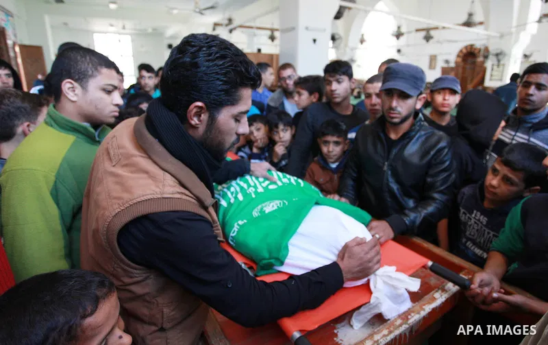 Relatives mourn over the body of Maher Atallah a 54-year-old Palestinian man who was killed the previous day in clashes with Israeli troops, during his funeral at the mosque, in Beit Lahia, in the northern Gaza Strip, on...