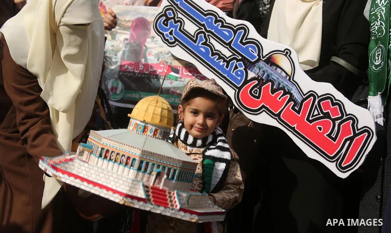 Palestinian students take part in a protest against US President Donald Trump's decision to recognise Jerusalem as the capital of Israel, in Gaza city on December 10, 2017. Photo by Ashraf Amra