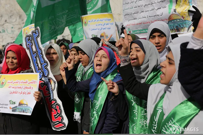 Palestinian students take part in a protest against US President Donald Trump's decision to recognise Jerusalem as the capital of Israel, in Gaza city on December 10, 2017. Photo by Ashraf Amra