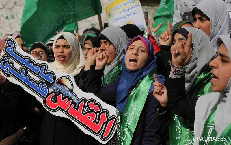 Palestinian students take part in a protest against US President Donald Trump's decision to recognise Jerusalem as the capital of Israel, in Gaza city on December 10, 2017. Photo by Ashraf Amra