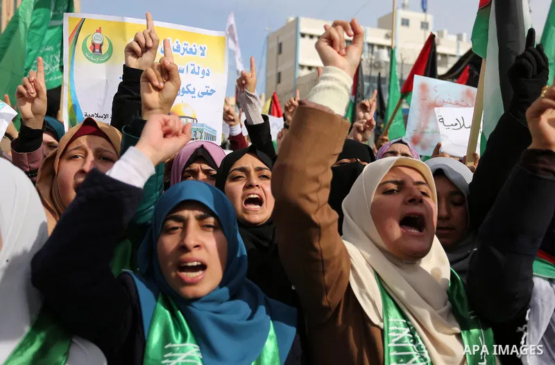 Palestinian students take part in a protest against US President Donald Trump's decision to recognise Jerusalem as the capital of Israel, in Gaza city on December 10, 2017. Photo by Ashraf Amra
