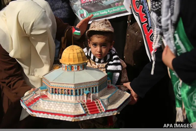 Palestinian students take part in a protest against US President Donald Trump's decision to recognise Jerusalem as the capital of Israel, in Gaza city on December 10, 2017. Photo by Ashraf Amra