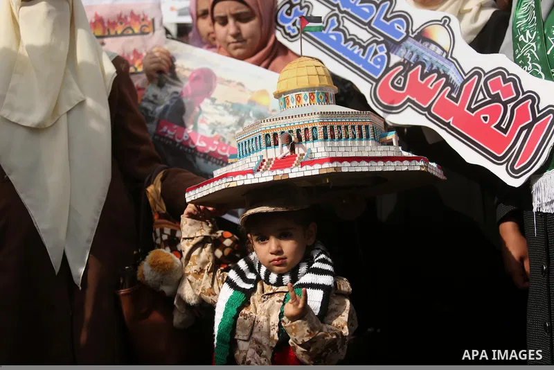 Palestinian students take part in a protest against US President Donald Trump's decision to recognise Jerusalem as the capital of Israel, in Gaza city on December 10, 2017. Photo by Ashraf Amra
