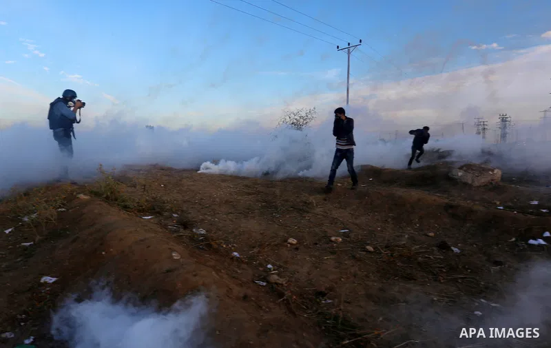 Palestinian protesters clash with Israeli secrity forces near the border fence with Israel, east of Gaza City on December 11, 2017 as demonstrations continue to flare in the Middle East and elsewhere over US President Do...