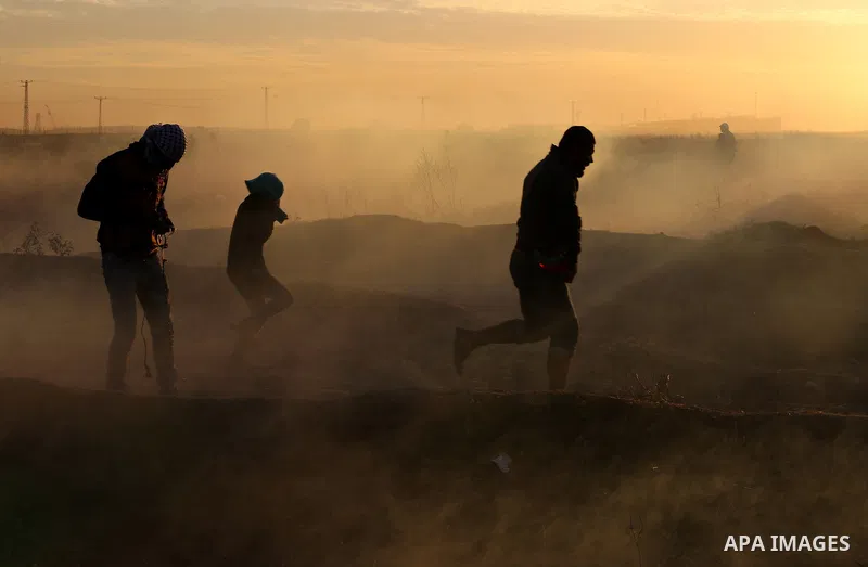 Palestinian protesters clash with Israeli secrity forces near the border fence with Israel, east of Gaza City on December 11, 2017 as demonstrations continue to flare in the Middle East and elsewhere over US President Do...