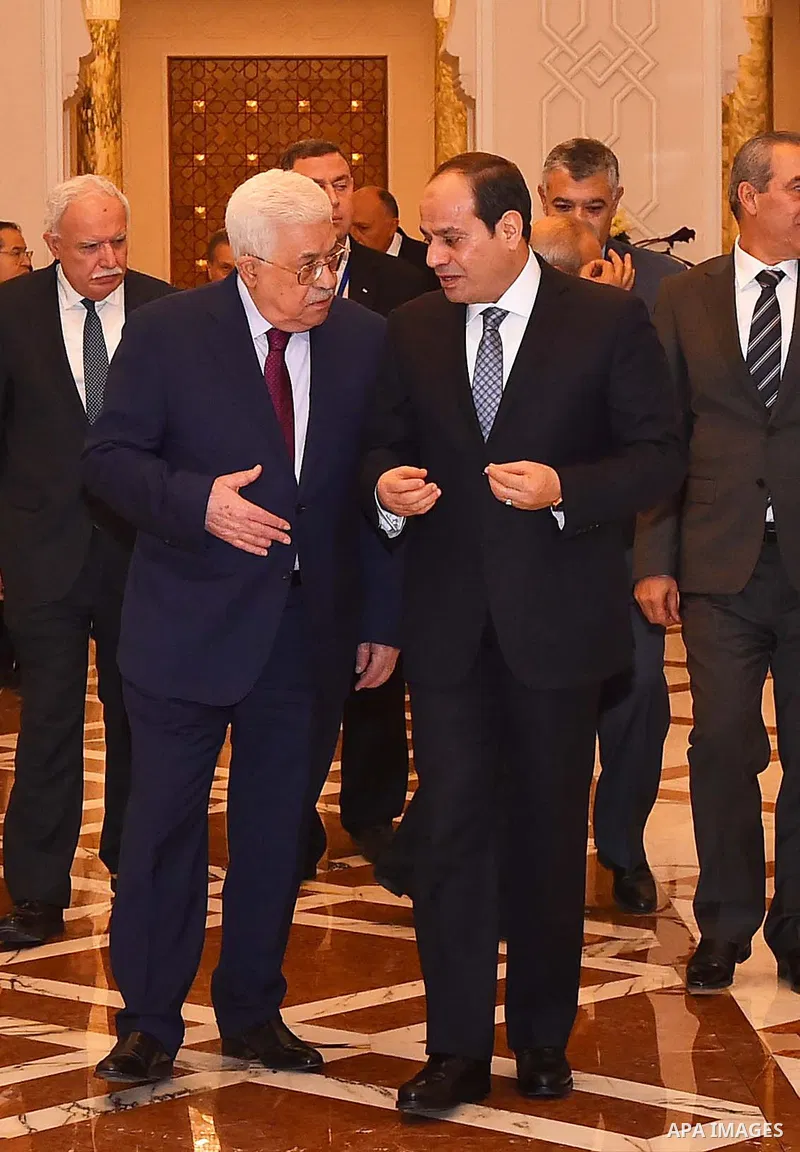 Egyptian President Abdel-Fattah al-Sisi (R) meets with Palestinian President Mahmoud Abbas in Cairo, Egypt, on Dec. 11, 2017. Egyptian President Abdel-Fattah al-Sisi stressed on Monday his country's firm stance on the ne...