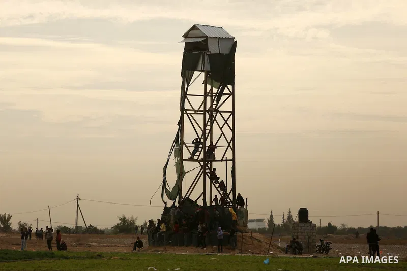 Palestinian protesters clash with Israeli security forces near the Israel-Gaza border east of the southern Gaza strip city of Khan Yunis on December 12, 2017 with Israeli heavy machinery seen in the background on the oth...
