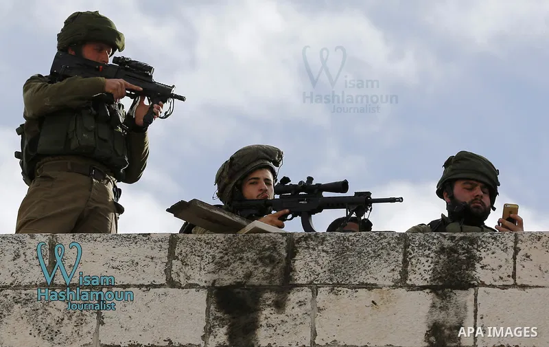 Israeli security forces take position during a demonstration in the West Bank town of Hebron on December 13, 2017. Photo by Wisam Hashlamoun