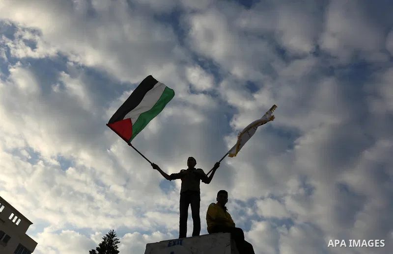 Palestinians take part in a protest against US President Donald Trump's decision to recognise Jerusalem as the capital of Israel in Gaza City, December 13, 2017. Photo by Ashraf Amra