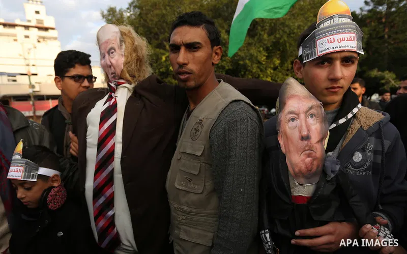 Palestinians take part in a protest against US President Donald Trump's decision to recognise Jerusalem as the capital of Israel in Gaza City, December 13, 2017. Photo by Ashraf Amra