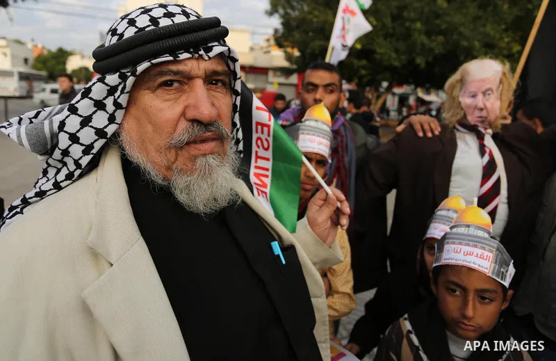 Palestinians take part in a protest against US President Donald Trump's decision to recognise Jerusalem as the capital of Israel in Gaza City, December 13, 2017. Photo by Ashraf Amra