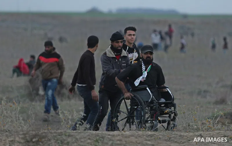 Palestinian protesters clash with Israeli secrity forces near the border fence with Israel, east of Gaza City on December 13, 2017 as demonstrations continue to flare in the Middle East and elsewhere over US President Do...