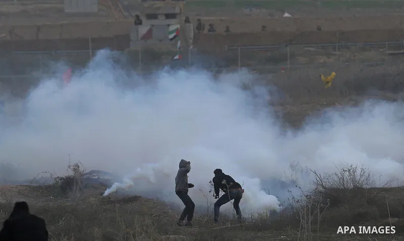Palestinian protesters clash with Israeli secrity forces near the border fence with Israel, east of Gaza City on December 13, 2017 as demonstrations continue to flare in the Middle East and elsewhere over US President Do...
