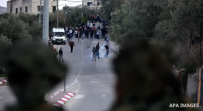Palestinian protestors, from the nearby Palestinian village of Naqura, confront Israeli security forces close to the Jewish settlement of Shavei Shomron near the West Bank city of Tulkarem on December 14, 2017, as protes...