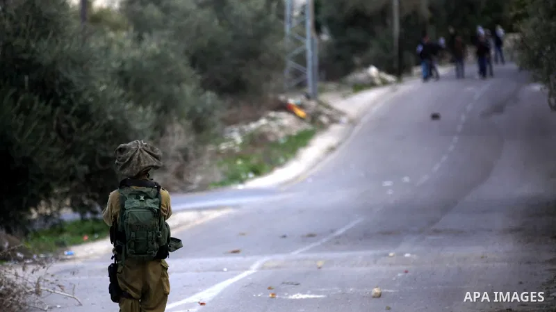 Palestinian protestors, from the nearby Palestinian village of Naqura, confront Israeli security forces close to the Jewish settlement of Shavei Shomron near the West Bank city of Tulkarem on December 14, 2017, as protes...