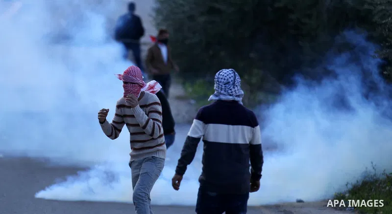 Palestinian protestors, from the nearby Palestinian village of Naqura, confront Israeli security forces close to the Jewish settlement of Shavei Shomron near the West Bank city of Tulkarem on December 14, 2017, as protes...