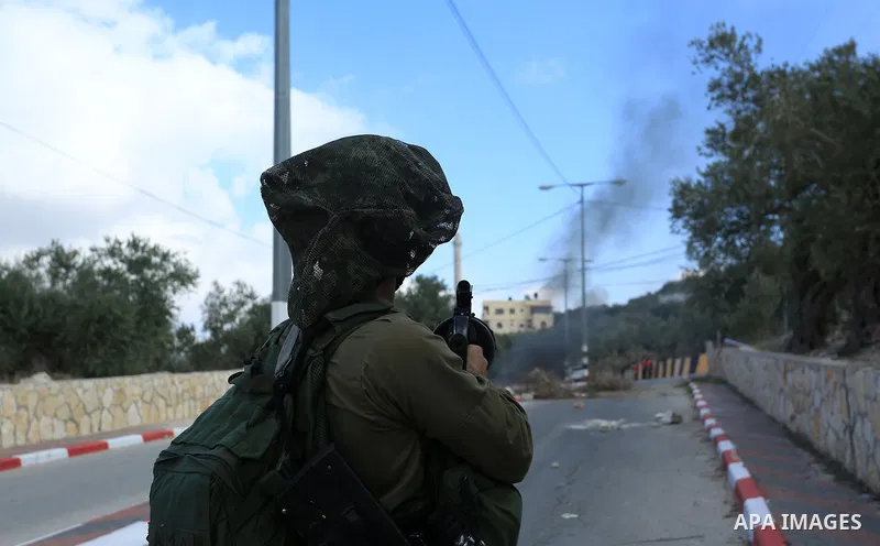 Palestinian protestors, from the nearby Palestinian village of Naqura, confront Israeli security forces close to the Jewish settlement of Shavei Shomron near the West Bank city of Tulkarem on December 14, 2017, as protes...
