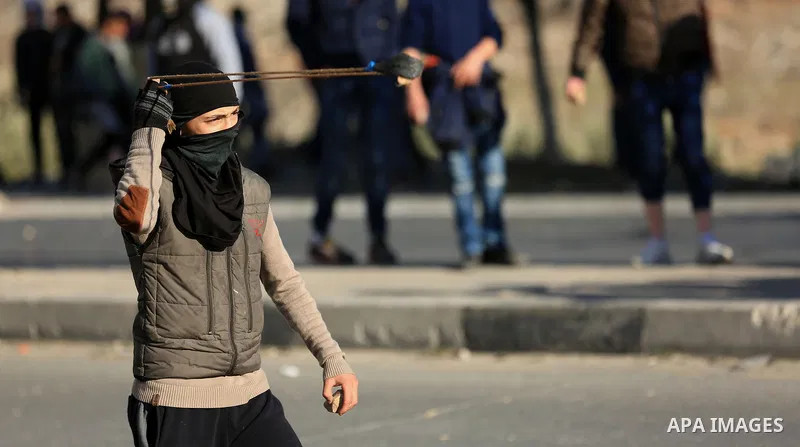 Palestinian protesters clash with Israeli soldiers, in Hawara checkpoint, south of the West Bank city of Nablus, on December 14, 2017, as protests continue in the region amid anger over US President Donald Trump's recogn...