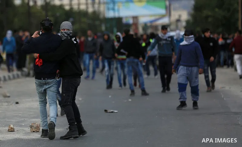 Palestinian protesters clash with Israeli soldiers, in Hawara checkpoint, south of the West Bank city of Nablus, on December 14, 2017, as protests continue in the region amid anger over US President Donald Trump's recogn...
