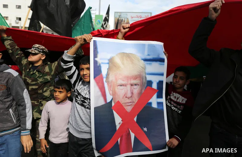 Palestinians take part during a protest against US President Donald Trump's decision to recognise Jerusalem as the capital of Israel, in al-Bureij in the central of Gaza strip, on December 15, 2017. Thousands of Palestin...