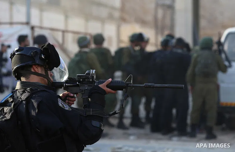 Israeli border clash with Palestinian protesters near the Huwara checkpoint, south of Nablus in the Israeli-occupied West Bank, on December 15, 2017, as protests continue in the region amid anger over US President Donald...