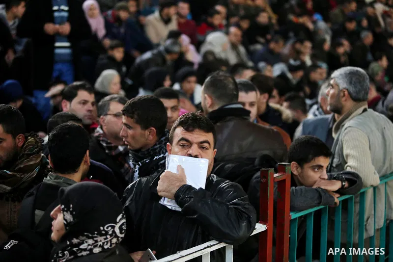 Palestinians wait for travel permits to cross into Egypt through the Rafah border crossing, in Khan Younis in the southern Gaza Strip December 16, 2017. The Palestinian crossing and borders Authority in the Gaza Strip an...