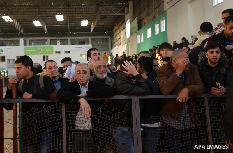Palestinians wait for travel permits to cross into Egypt through the Rafah border crossing, in Khan Younis in the southern Gaza Strip December 16, 2017. The Palestinian crossing and borders Authority in the Gaza Strip an...