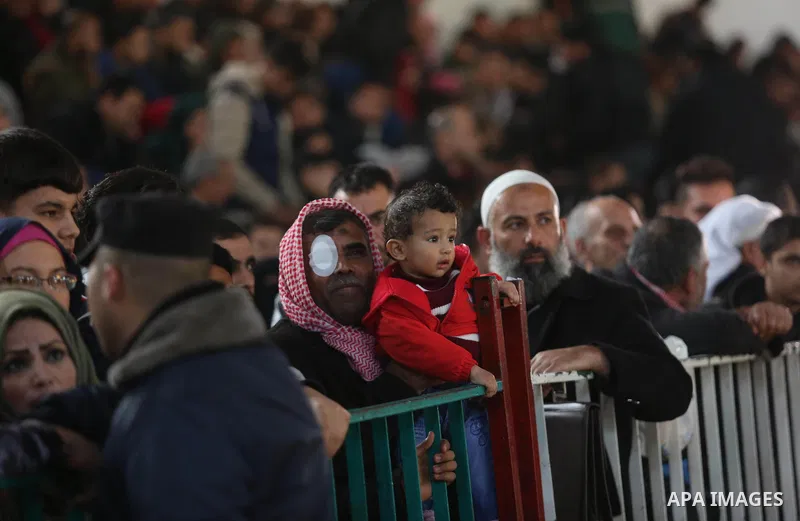 Palestinians wait for travel permits to cross into Egypt through the Rafah border crossing, in Khan Younis in the southern Gaza Strip December 16, 2017. The Palestinian crossing and borders Authority in the Gaza Strip an...