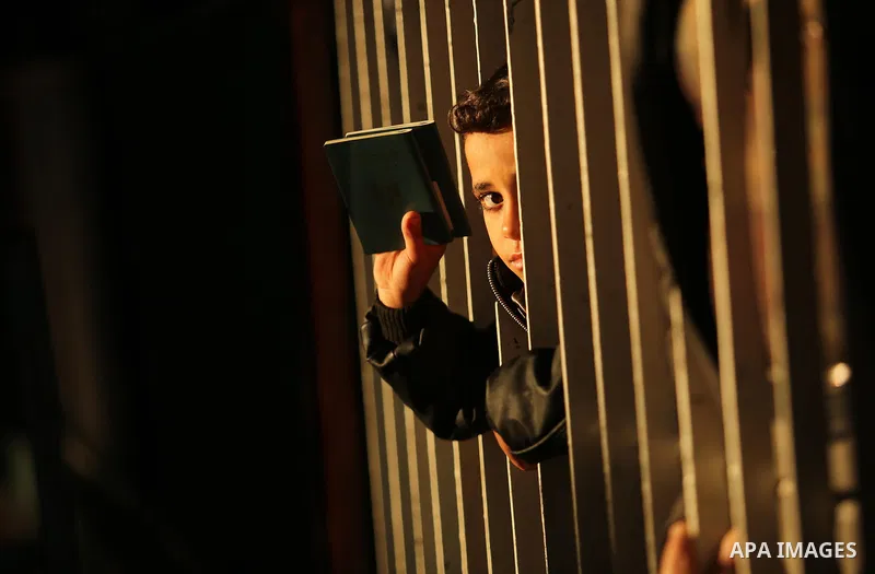 Palestinians wait for travel permits to cross into Egypt through the Rafah border crossing, in Khan Younis in the southern Gaza Strip December 16, 2017. The Palestinian crossing and borders Authority in the Gaza Strip an...