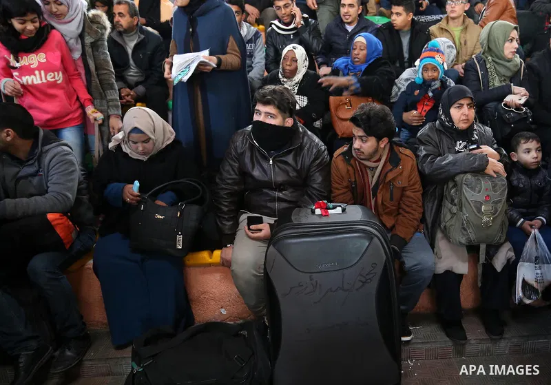 Palestinians wait for travel permits to cross into Egypt through the Rafah border crossing, in Khan Younis in the southern Gaza Strip December 16, 2017. The Palestinian crossing and borders Authority in the Gaza Strip an...