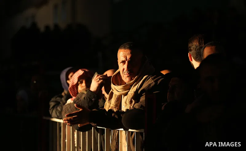 Palestinians wait for travel permits to cross into Egypt through the Rafah border crossing, in Khan Younis in the southern Gaza Strip December 16, 2017. The Palestinian crossing and borders Authority in the Gaza Strip an...