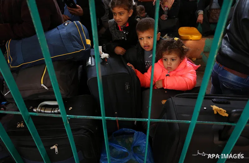 Palestinians wait for travel permits to cross into Egypt through the Rafah border crossing after it was opened by Egyptian authorities for humanitarian cases, in the southern Gaza Strip December 17, 2017. Photo by Ashraf...
