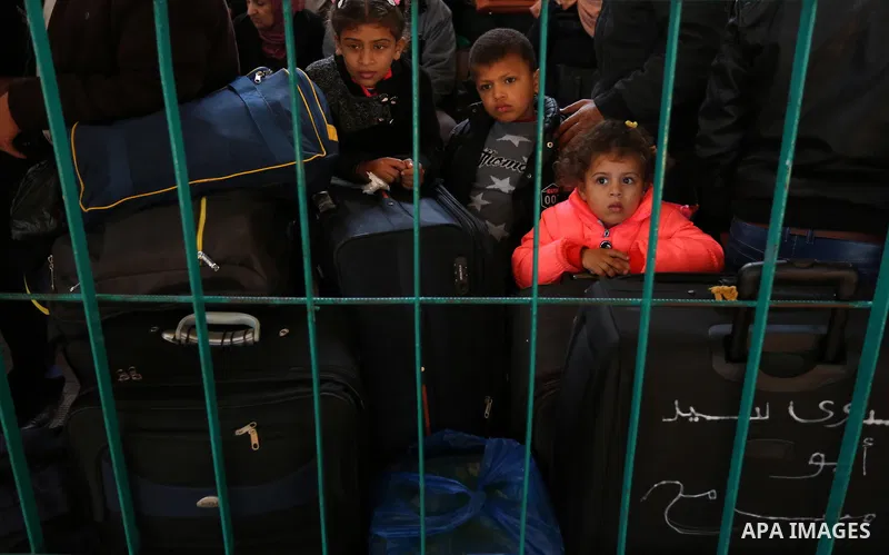 Palestinians wait for travel permits to cross into Egypt through the Rafah border crossing after it was opened by Egyptian authorities for humanitarian cases, in the southern Gaza Strip December 17, 2017. Photo by Ashraf...