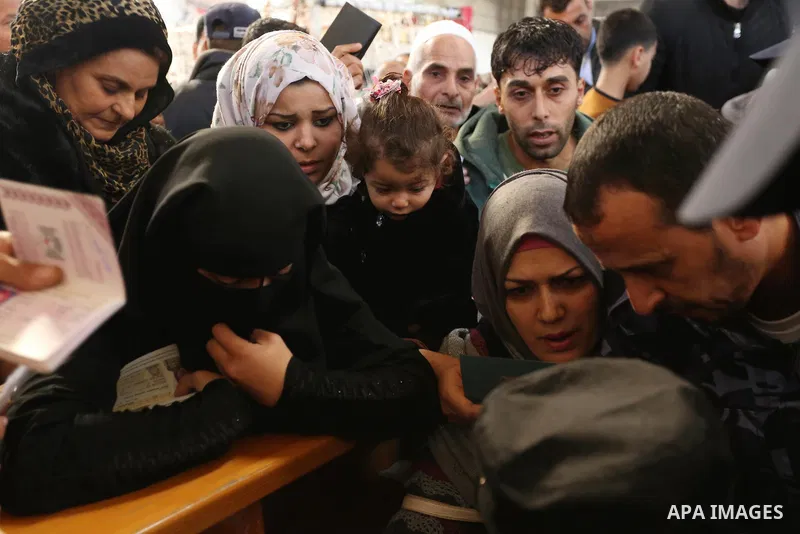 Palestinians wait for travel permits to cross into Egypt through the Rafah border crossing after it was opened by Egyptian authorities for humanitarian cases, in the southern Gaza Strip December 17, 2017. Photo by Ashraf...