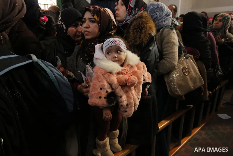 Palestinians wait for travel permits to cross into Egypt through the Rafah border crossing after it was opened by Egyptian authorities for humanitarian cases, in the southern Gaza Strip December 17, 2017. Photo by Ashraf...