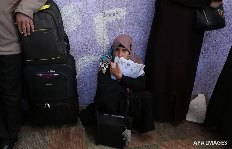 Palestinians wait for travel permits to cross into Egypt through the Rafah border crossing after it was opened by Egyptian authorities for humanitarian cases, in the southern Gaza Strip December 17, 2017. Photo by Ashraf...