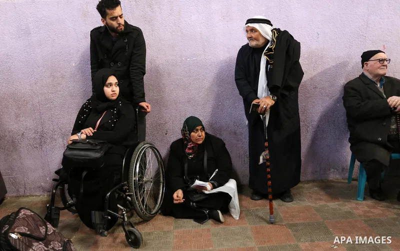 Palestinians wait for travel permits to cross into Egypt through the Rafah border crossing after it was opened by Egyptian authorities for humanitarian cases, in the southern Gaza Strip December 17, 2017. Photo by Ashraf...