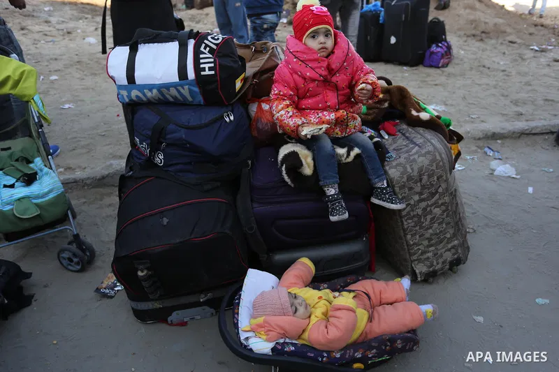 Palestinians wait for travel permits to cross into Egypt through the Rafah border crossing after it was opened by Egyptian authorities for humanitarian cases, in the southern Gaza Strip December 17, 2017. Photo by Ashraf...