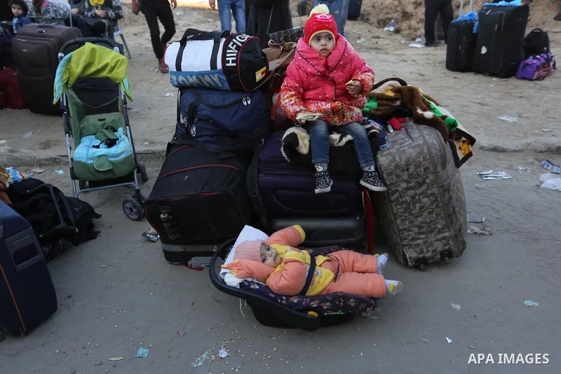 Palestinians wait for travel permits to cross into Egypt through the Rafah border crossing after it was opened by Egyptian authorities for humanitarian cases, in the southern Gaza Strip December 17, 2017. Photo by Ashraf...