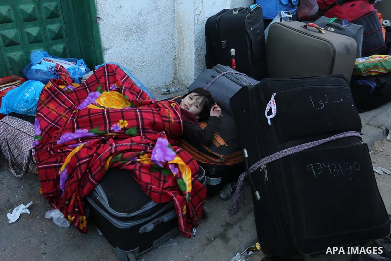Palestinians wait for travel permits to cross into Egypt through the Rafah border crossing after it was opened by Egyptian authorities for humanitarian cases, in the southern Gaza Strip December 17, 2017. Photo by Ashraf...