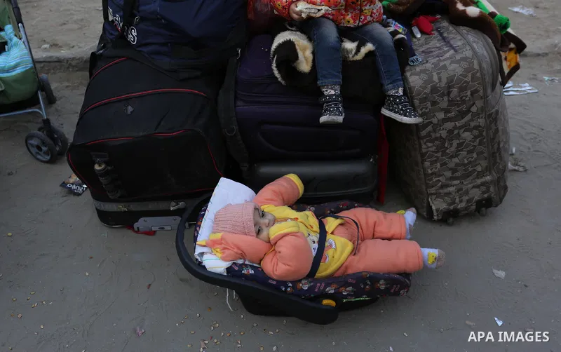 Palestinians wait for travel permits to cross into Egypt through the Rafah border crossing after it was opened by Egyptian authorities for humanitarian cases, in the southern Gaza Strip December 17, 2017. Photo by Ashraf...