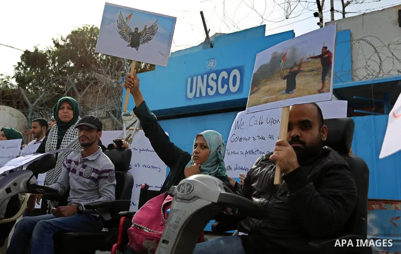 Disabled Palestinians take part in a protest against the killing of Ibraheem Abu Thuraya in front of the headquarter United Nation "UNESCO", in Gaza City, on December 21, 2017. Abu Thuraya, who was shot dead by Israeli s...